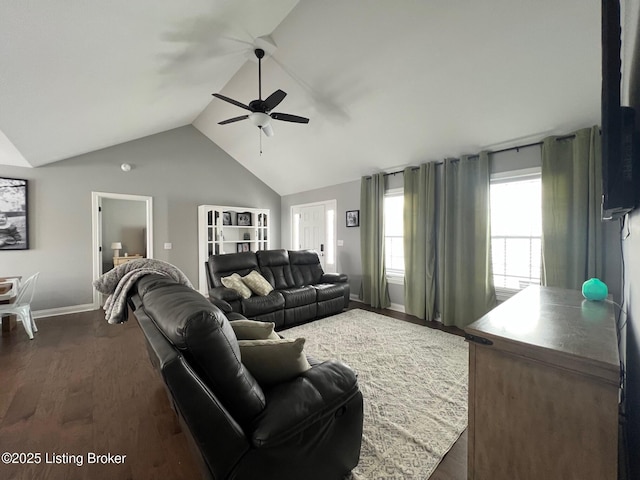 living room featuring vaulted ceiling, ceiling fan, and dark hardwood / wood-style floors