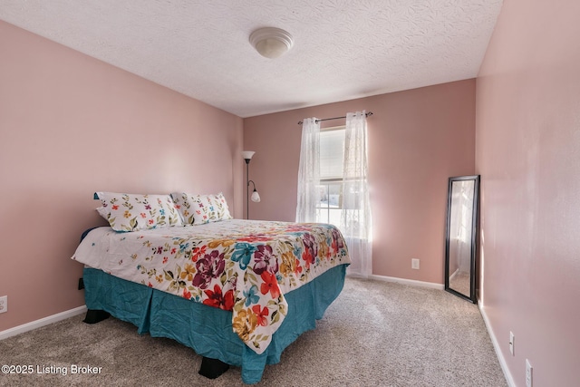 carpeted bedroom with a textured ceiling