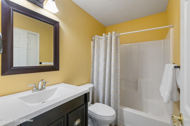 full bathroom with shower / bath combo with shower curtain, vanity, a textured ceiling, and toilet