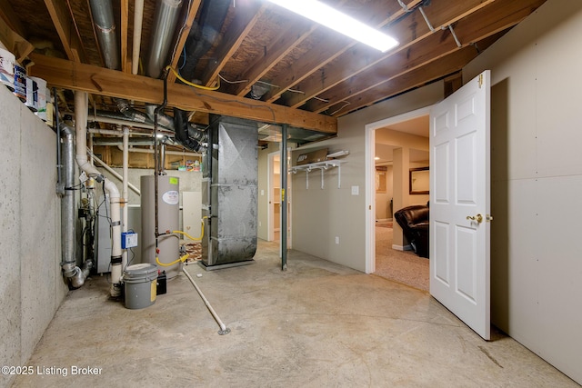 basement with gas water heater and heating unit