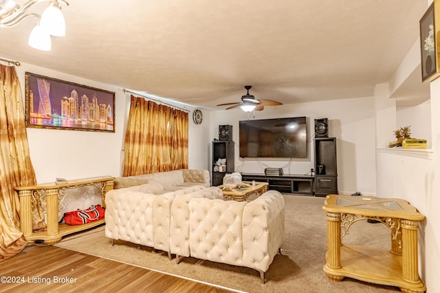 living room with ceiling fan and hardwood / wood-style flooring