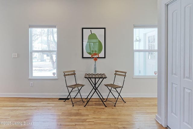 living area with light hardwood / wood-style floors