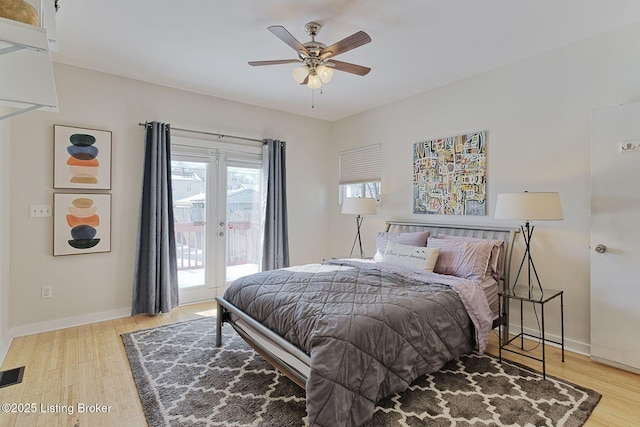 bedroom featuring light wood-type flooring, ceiling fan, and access to exterior