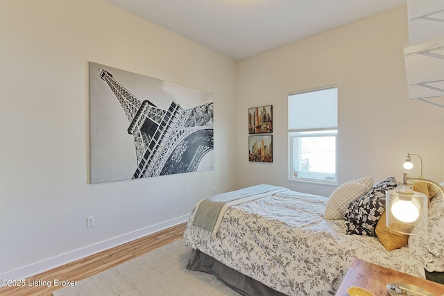 bedroom with wood-type flooring