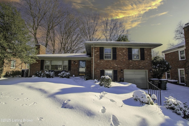 split level home featuring a garage