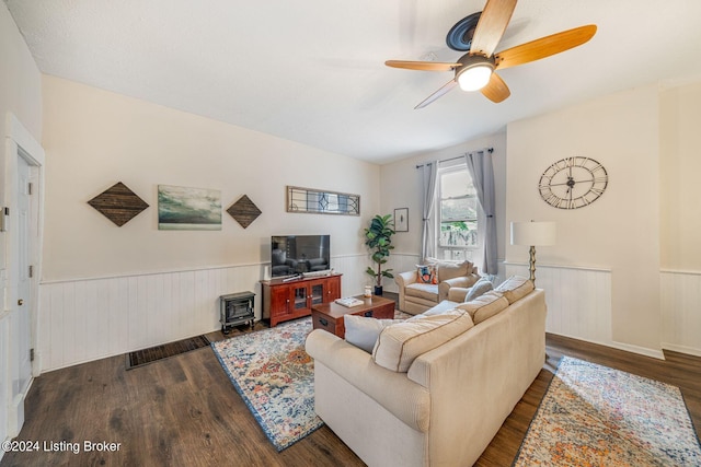 living room featuring dark hardwood / wood-style floors and ceiling fan