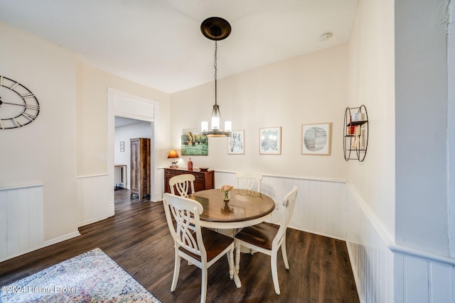 dining room featuring a chandelier and dark hardwood / wood-style flooring