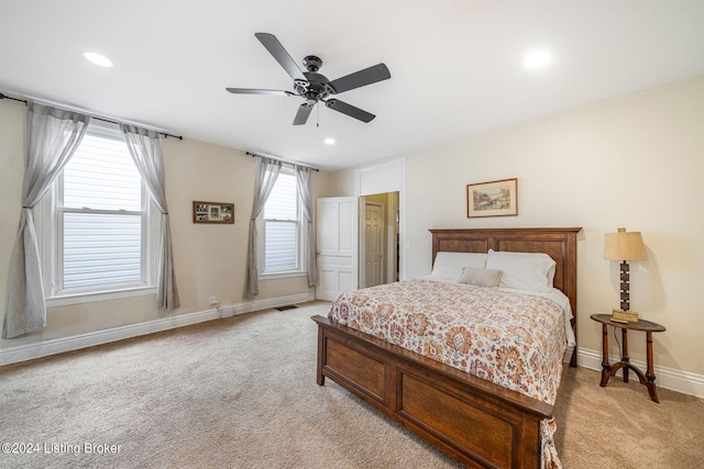 carpeted bedroom with ceiling fan