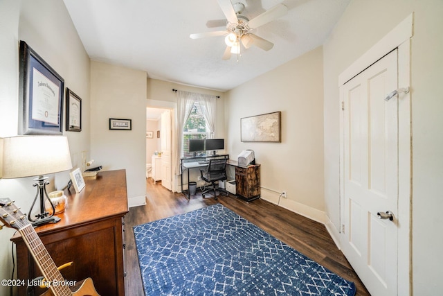 office area with dark hardwood / wood-style floors and ceiling fan