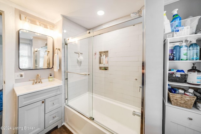 bathroom with vanity and bath / shower combo with glass door