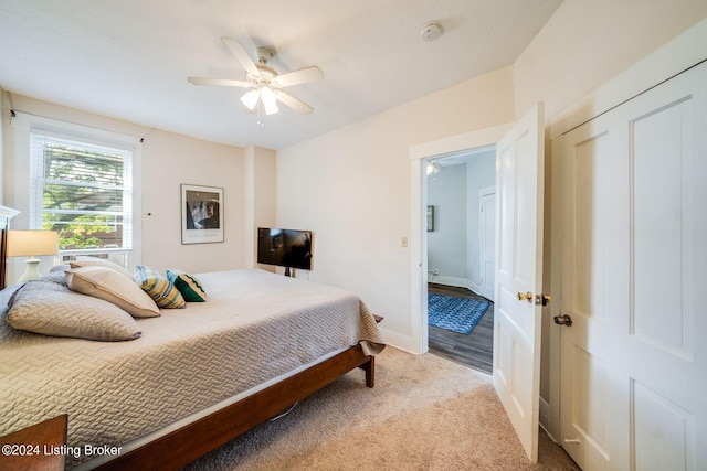 carpeted bedroom with ceiling fan