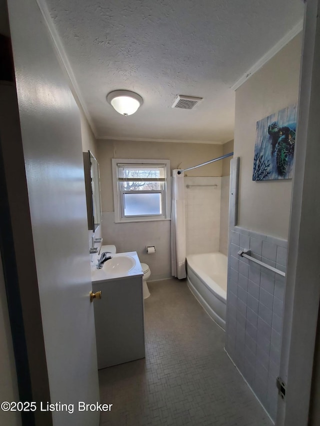 full bathroom with a textured ceiling, shower / tub combo, crown molding, and vanity