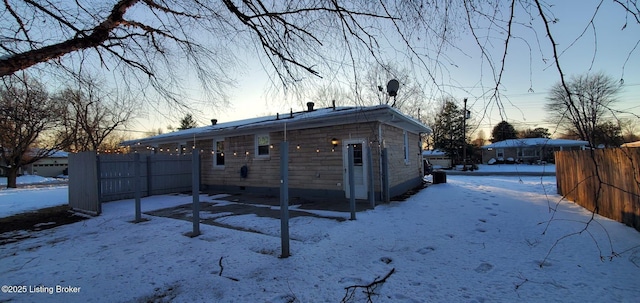 view of snow covered house