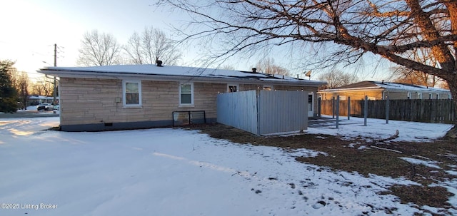 view of snow covered house