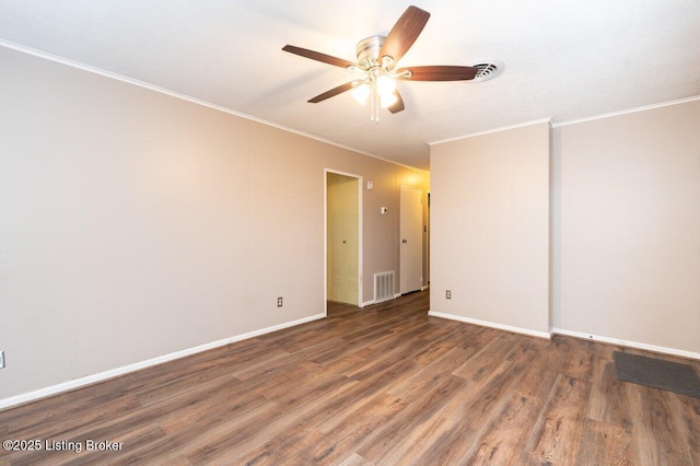 unfurnished room featuring ceiling fan, crown molding, and dark wood-type flooring