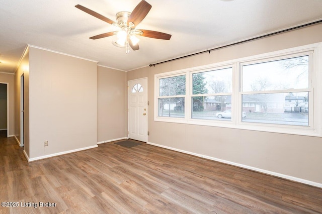 unfurnished room with ceiling fan and wood-type flooring