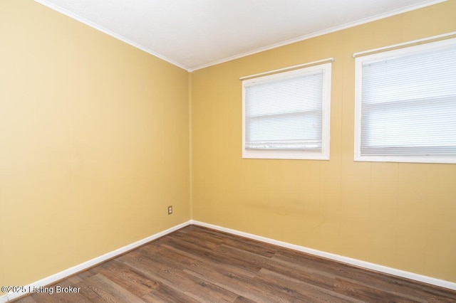 unfurnished room featuring ornamental molding and wood-type flooring