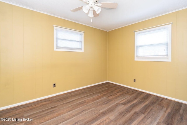 spare room with ceiling fan, crown molding, and hardwood / wood-style flooring