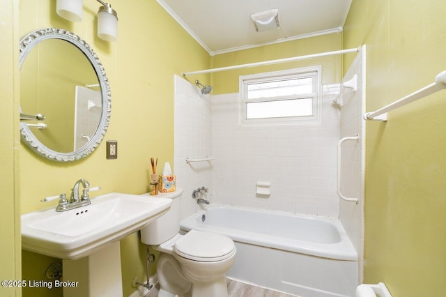 bathroom featuring toilet, ornamental molding, hardwood / wood-style flooring, and  shower combination