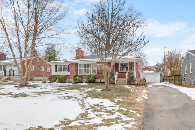 view of front of home with an outdoor structure and a garage