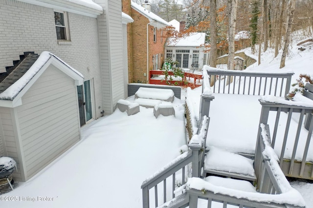 view of snow covered deck