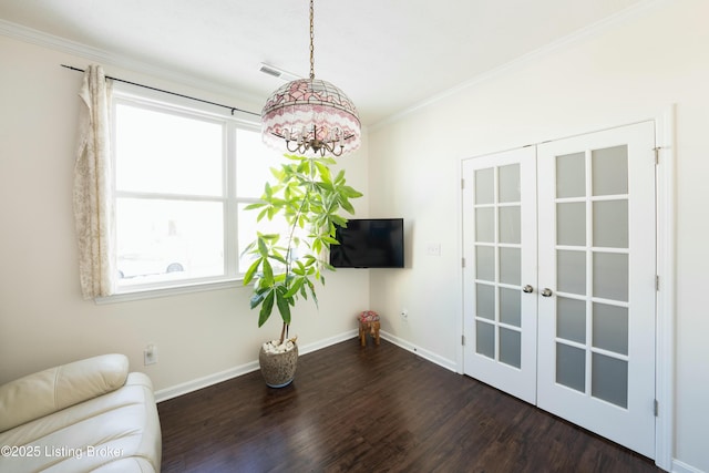 sitting room featuring french doors, dark hardwood / wood-style flooring, and crown molding