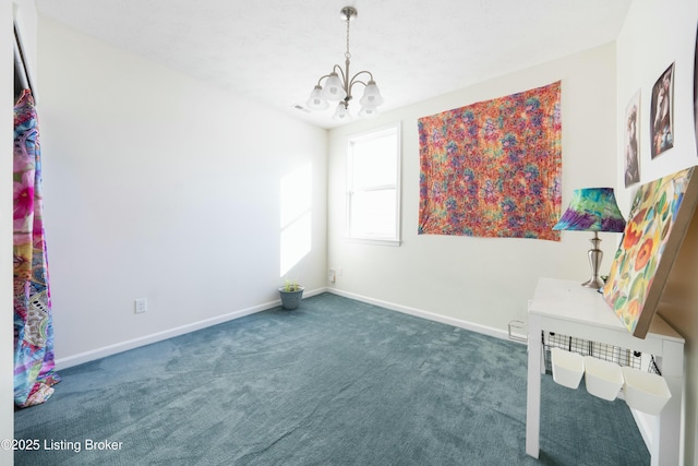 interior space featuring dark carpet and a notable chandelier