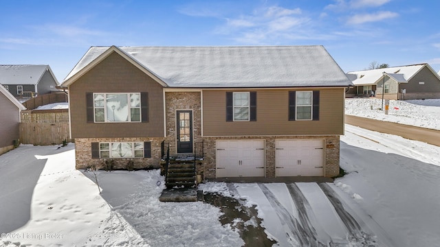 raised ranch featuring a garage