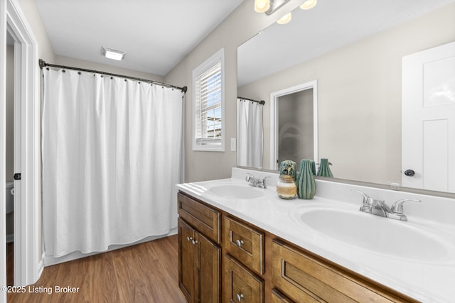 bathroom featuring vanity and wood-type flooring