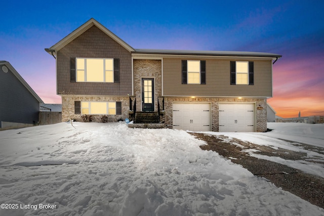 raised ranch featuring a garage