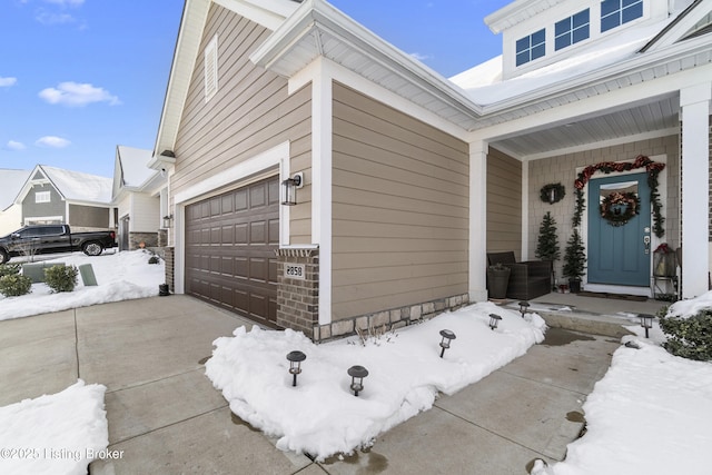 exterior space featuring covered porch and a garage