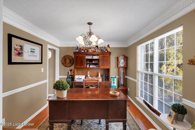 home office featuring an inviting chandelier, crown molding, wood-type flooring, and a textured ceiling