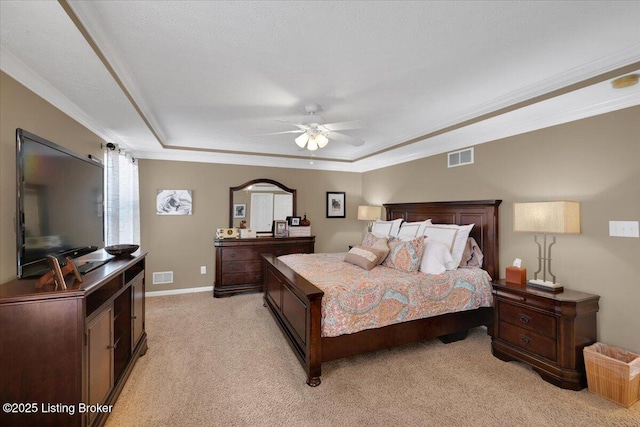 carpeted bedroom with crown molding, a raised ceiling, and ceiling fan