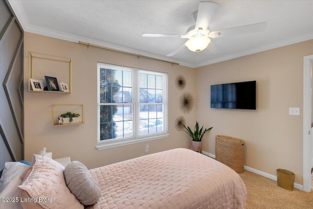 bedroom featuring ornamental molding, light colored carpet, ceiling fan, and a textured ceiling