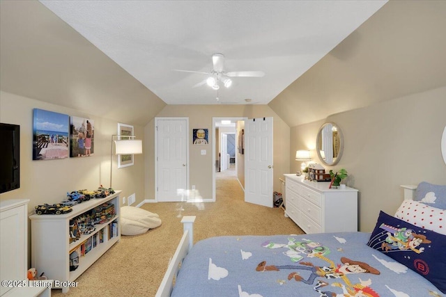 bedroom with lofted ceiling, light carpet, and ceiling fan