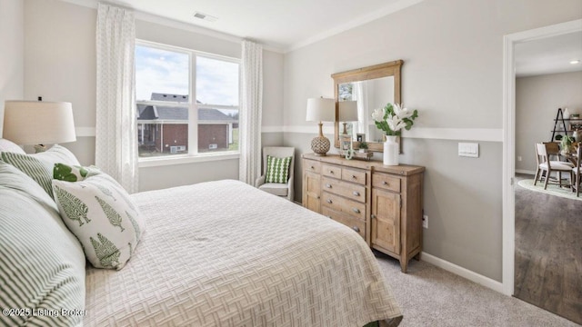 carpeted bedroom with crown molding