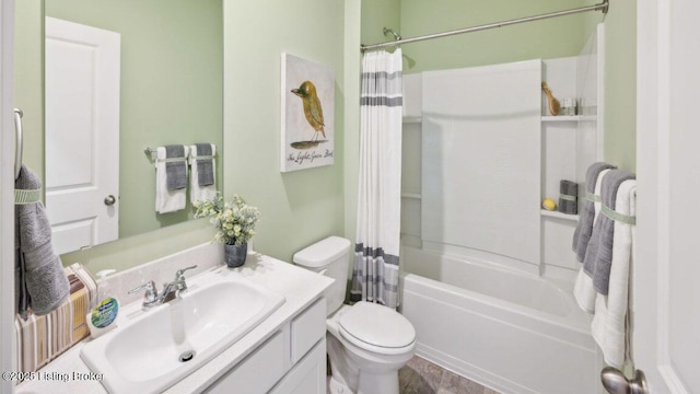 full bathroom with vanity, shower / tub combo, and toilet