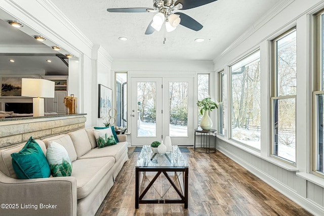 sunroom / solarium with ceiling fan