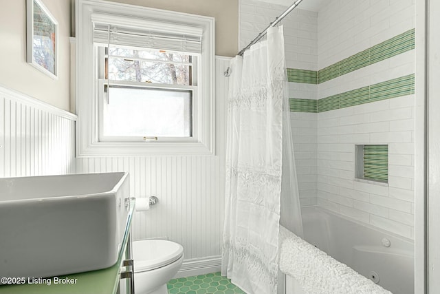 bathroom with toilet and shower / bathtub combination with curtain