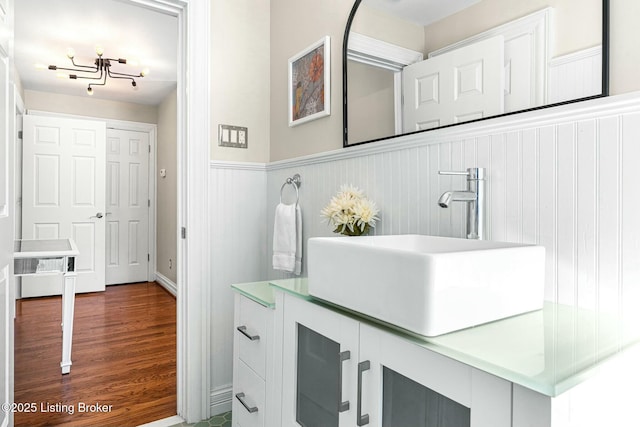 bathroom with vanity and wood-type flooring