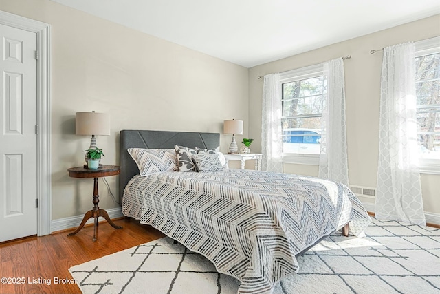 bedroom with wood-type flooring