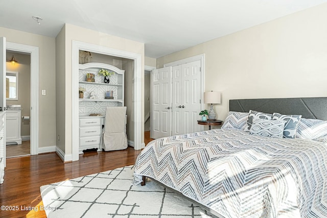 bedroom with dark wood-type flooring