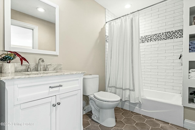 full bathroom featuring vanity, toilet, tile patterned floors, and shower / tub combo with curtain