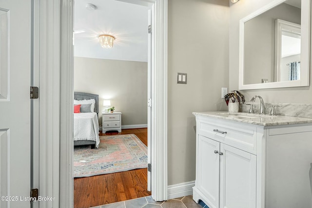 bathroom with tile patterned floors and vanity