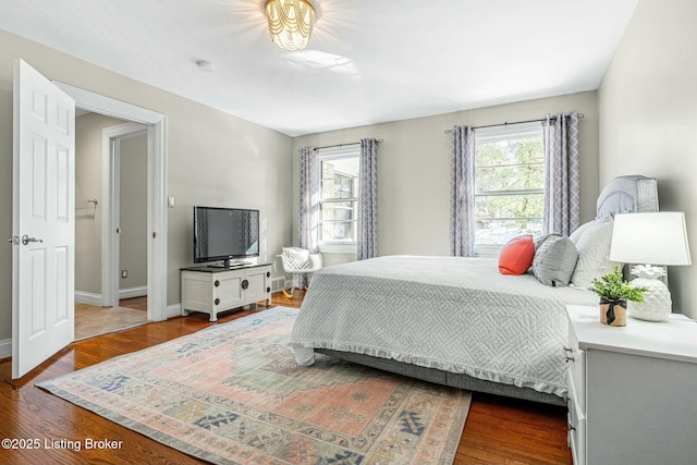 bedroom featuring dark wood-type flooring