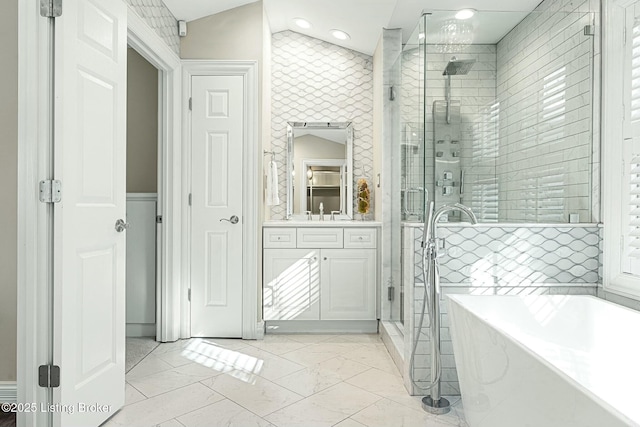 bathroom featuring vanity and separate shower and tub