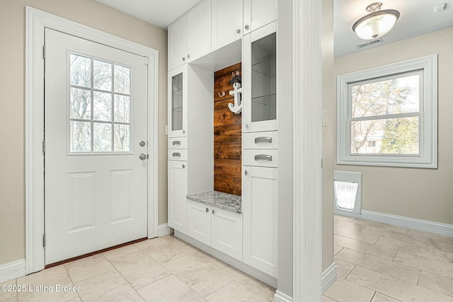 interior space with a wealth of natural light and light tile patterned floors