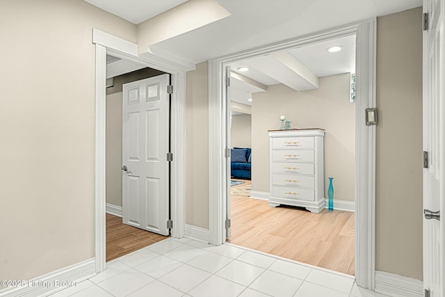 hall with light tile patterned flooring