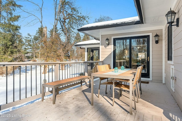 view of snow covered deck