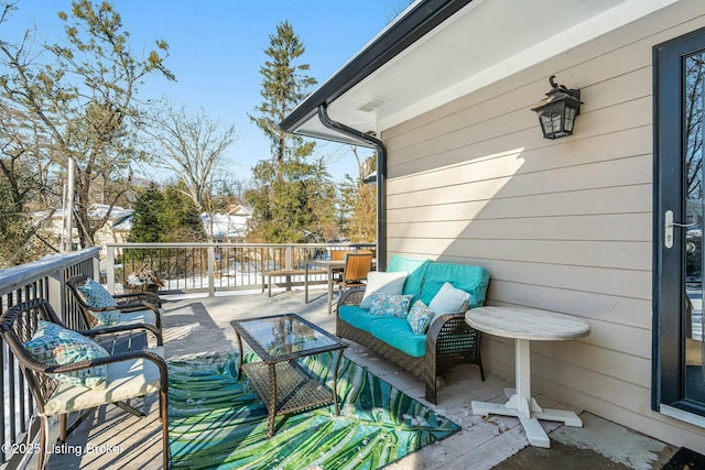 deck featuring outdoor lounge area